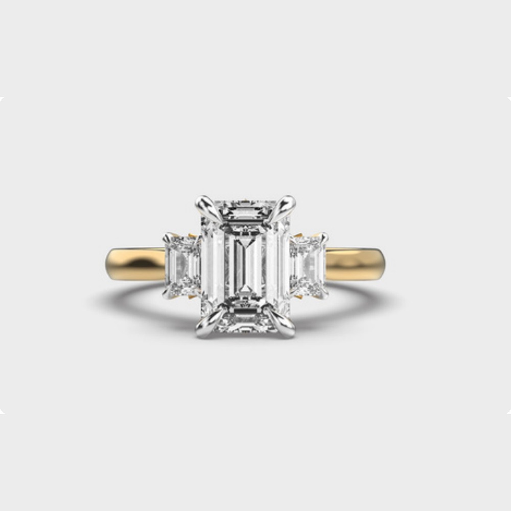 Emerald Side Stone Diamond Ring
